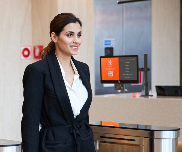 Business woman exiting a building through speed lanes