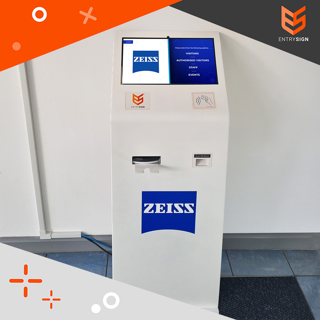 White visitor management kiosk with blue and white user interface and blue logo on the front.