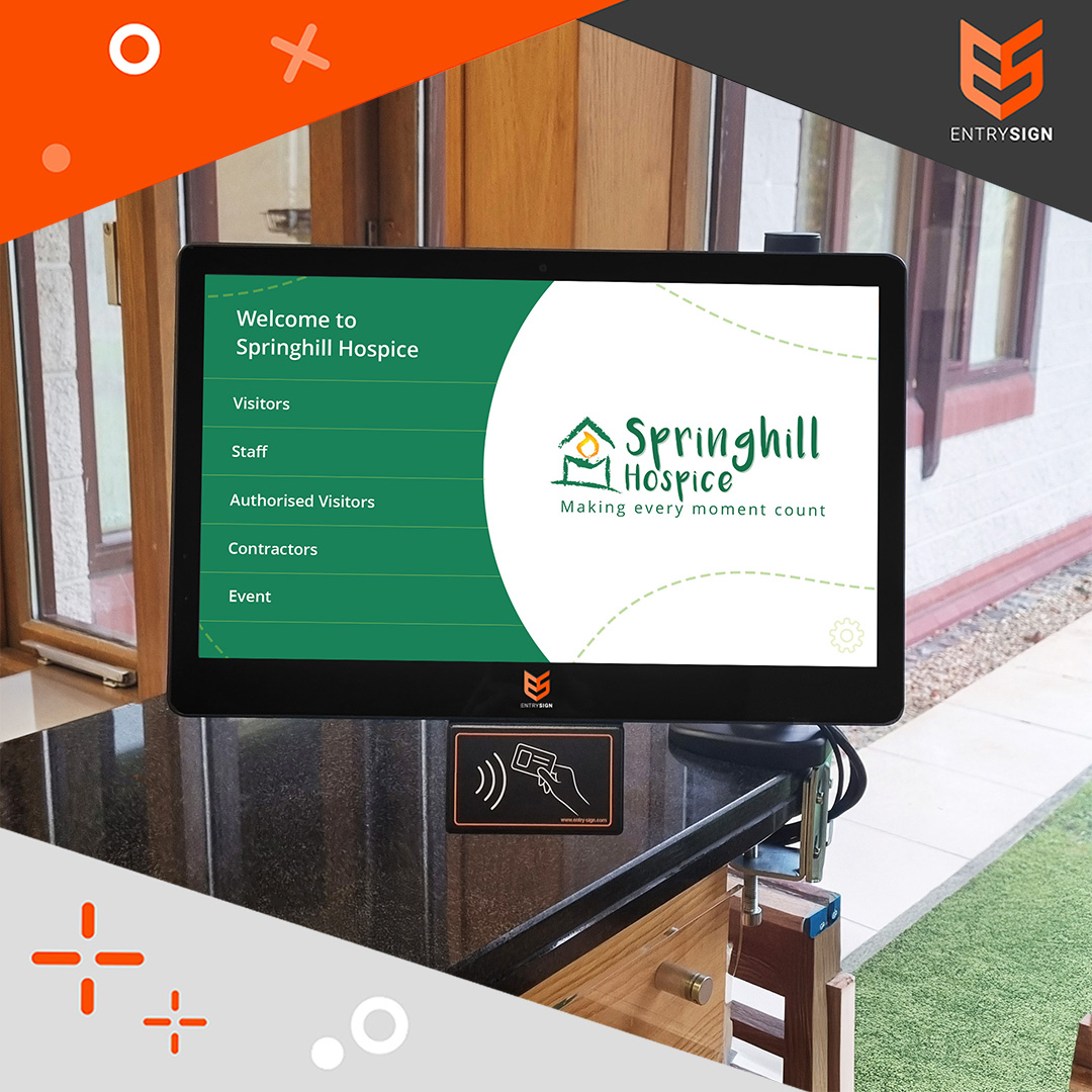 Visitor management screen with green and white interface fitted to a desk